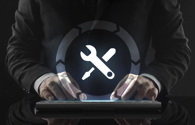 regclean pro registry cleaners software features man in black suit on wireless computer keyboard fixes system wrench and screwdriver symbol in a circle